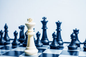 Chessboard and chess pieces, illustrating the importance of having a strategic game plan for IT asset management.