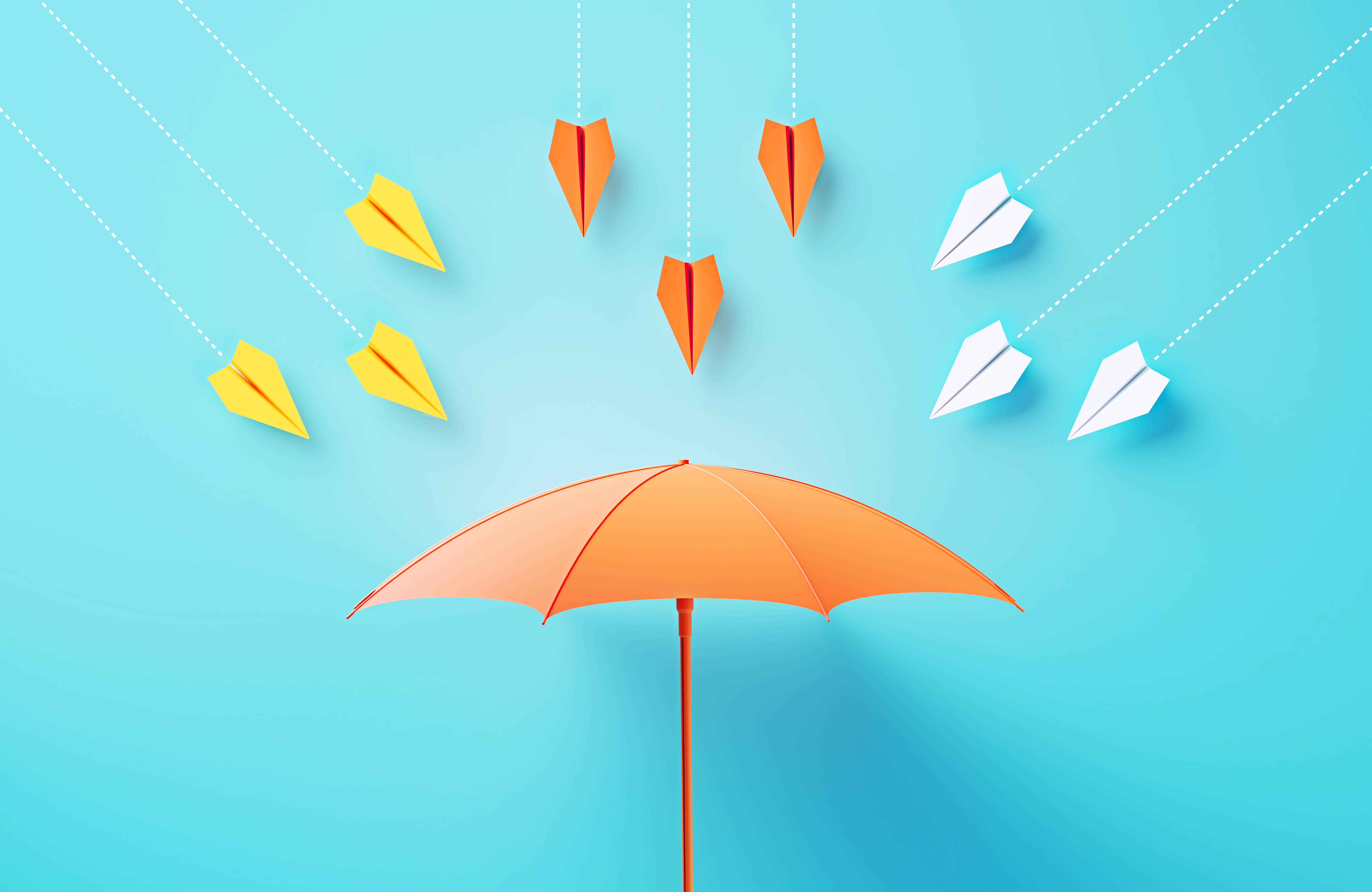 Paper airplanes flying towards a umbrella on blue background, illustrating the concept of risk management.
