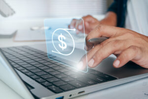 Closeup image of a church financial leader reviewing digital budget and financial information on a laptop computer.