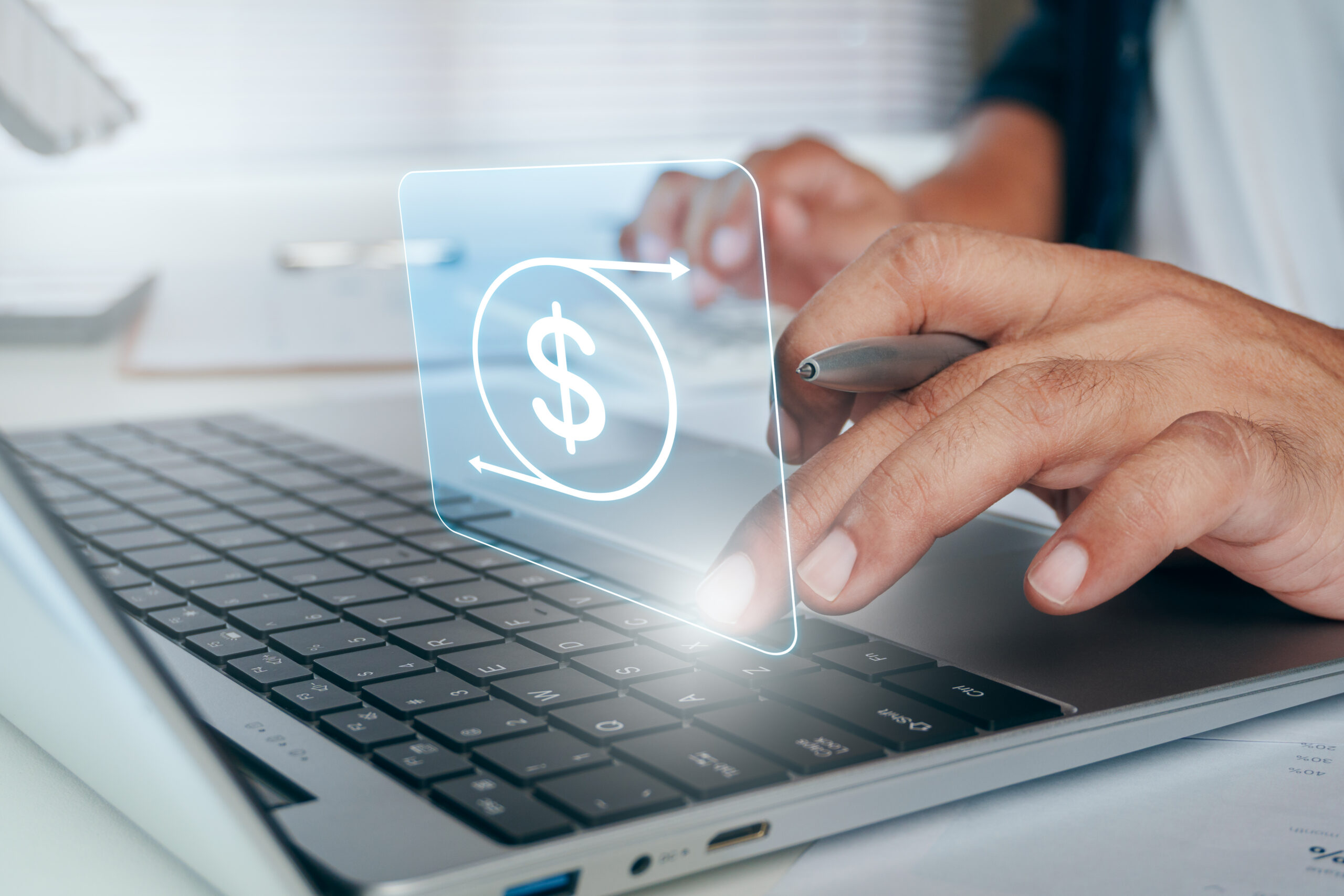 Closeup image of a church financial leader reviewing digital budget and financial information on a laptop computer.