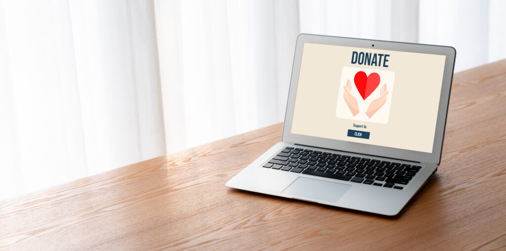 Laptop screen showing a graphic that says "Donate," representing the need for well-prepared charitable gift acknowledgments.