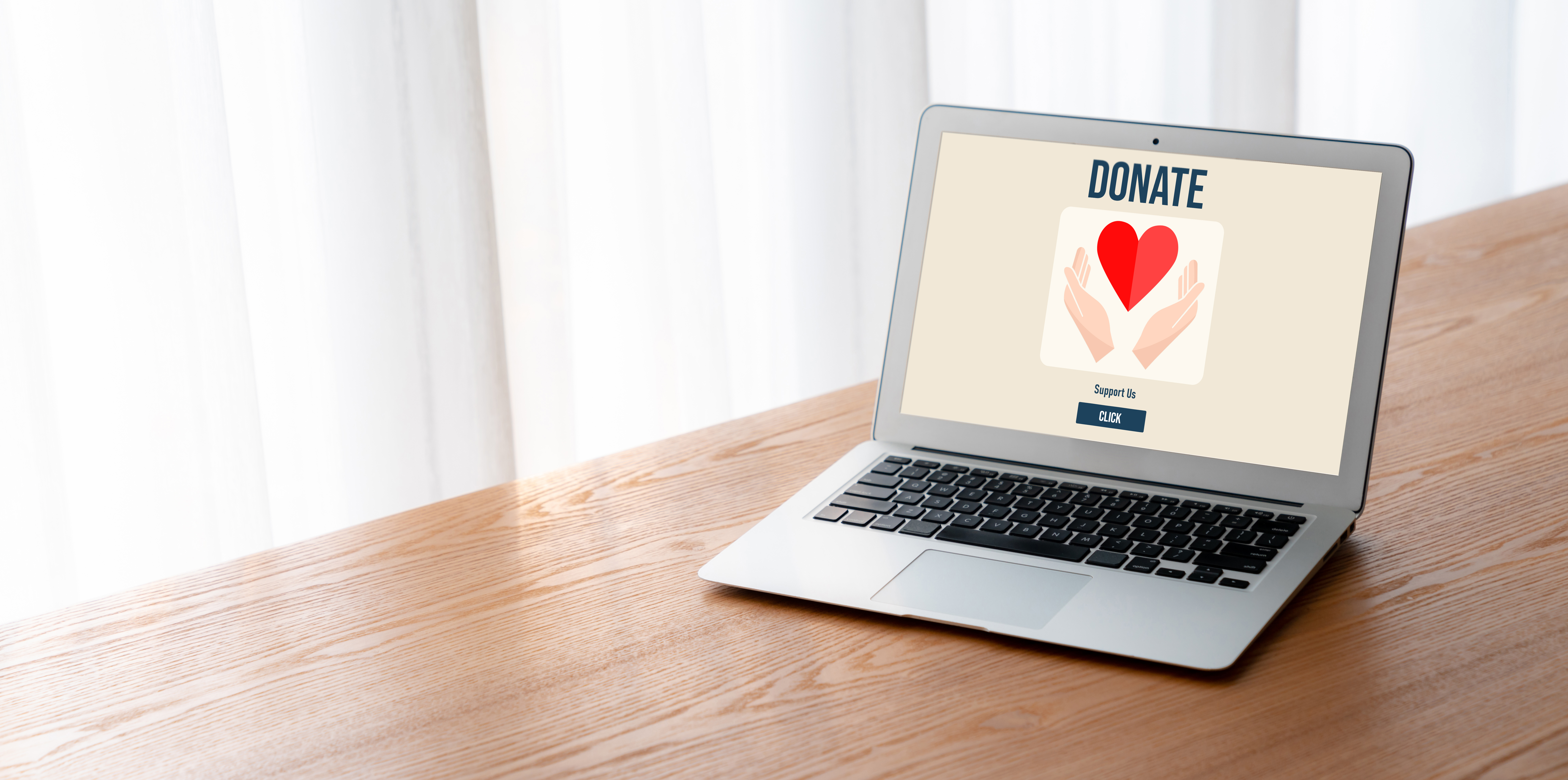 Laptop screen showing a graphic that says "Donate," representing the need for well-prepared charitable gift acknowledgments.